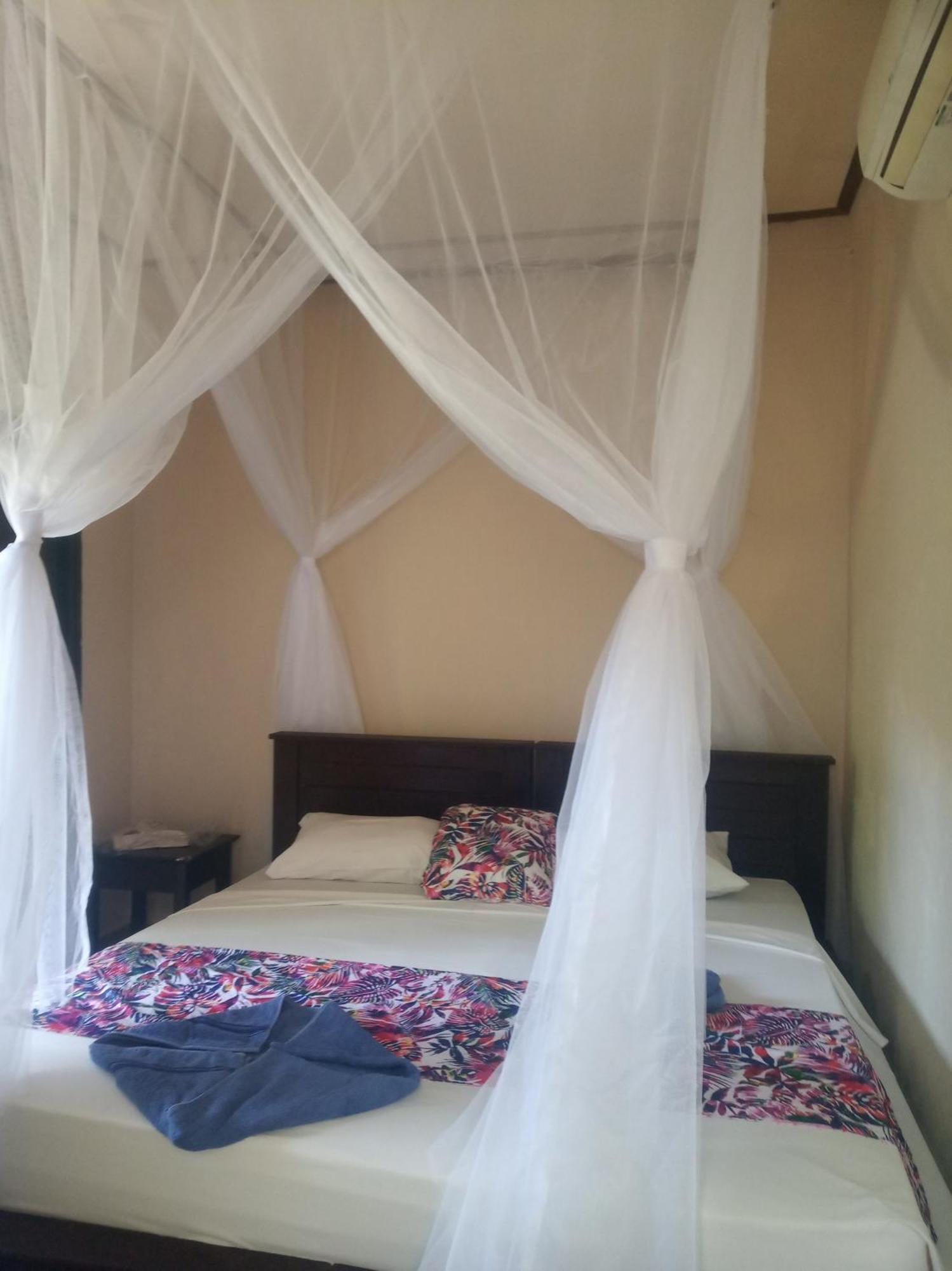 Mango Moon Hotel เปมูเตรัน ห้อง รูปภาพ